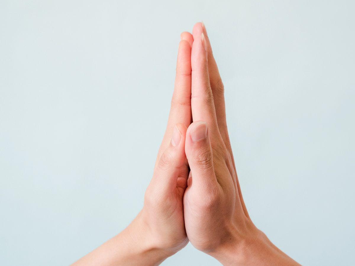 Two hands meeting in a gesture of connection