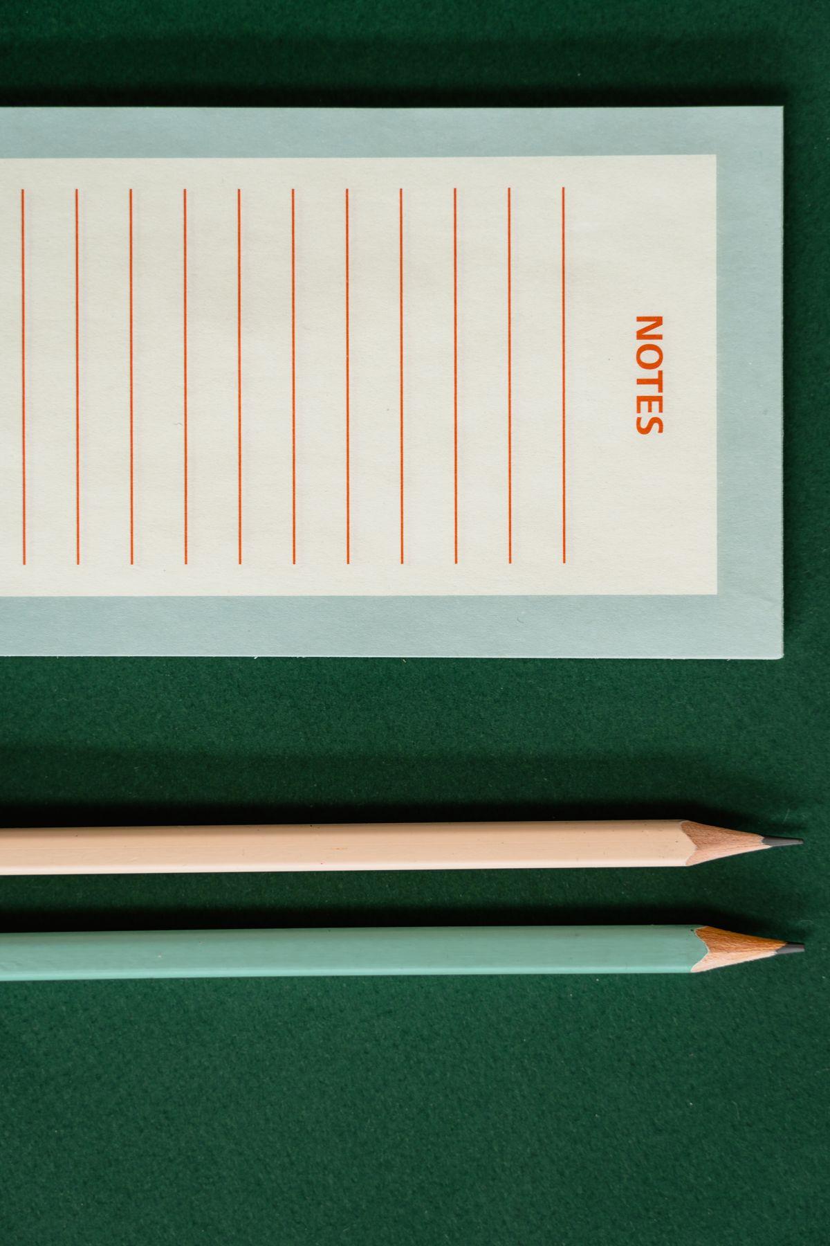 A blank notes page with two pencils